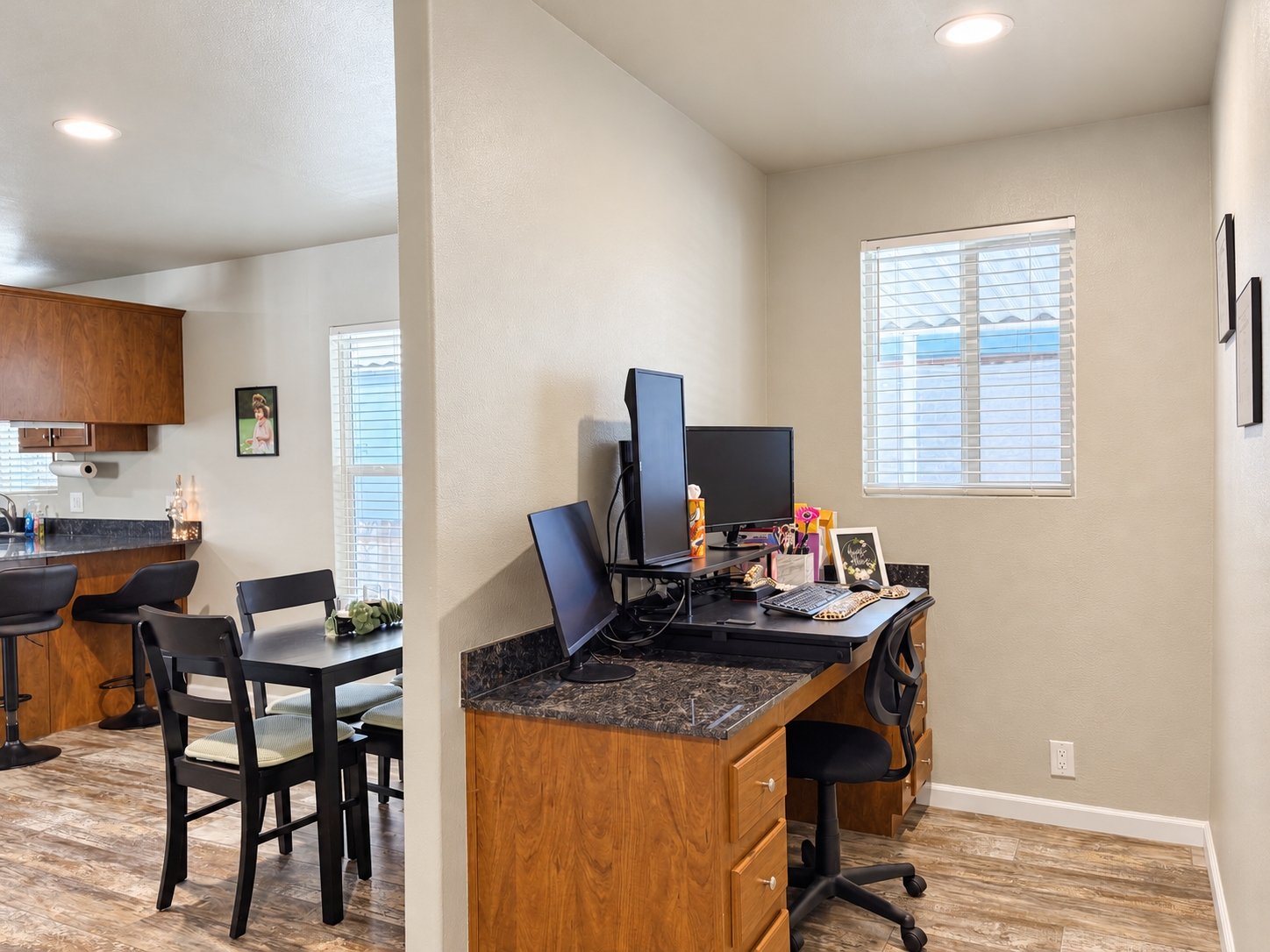 Built-in desk with drawers beside the dining area and kitchen